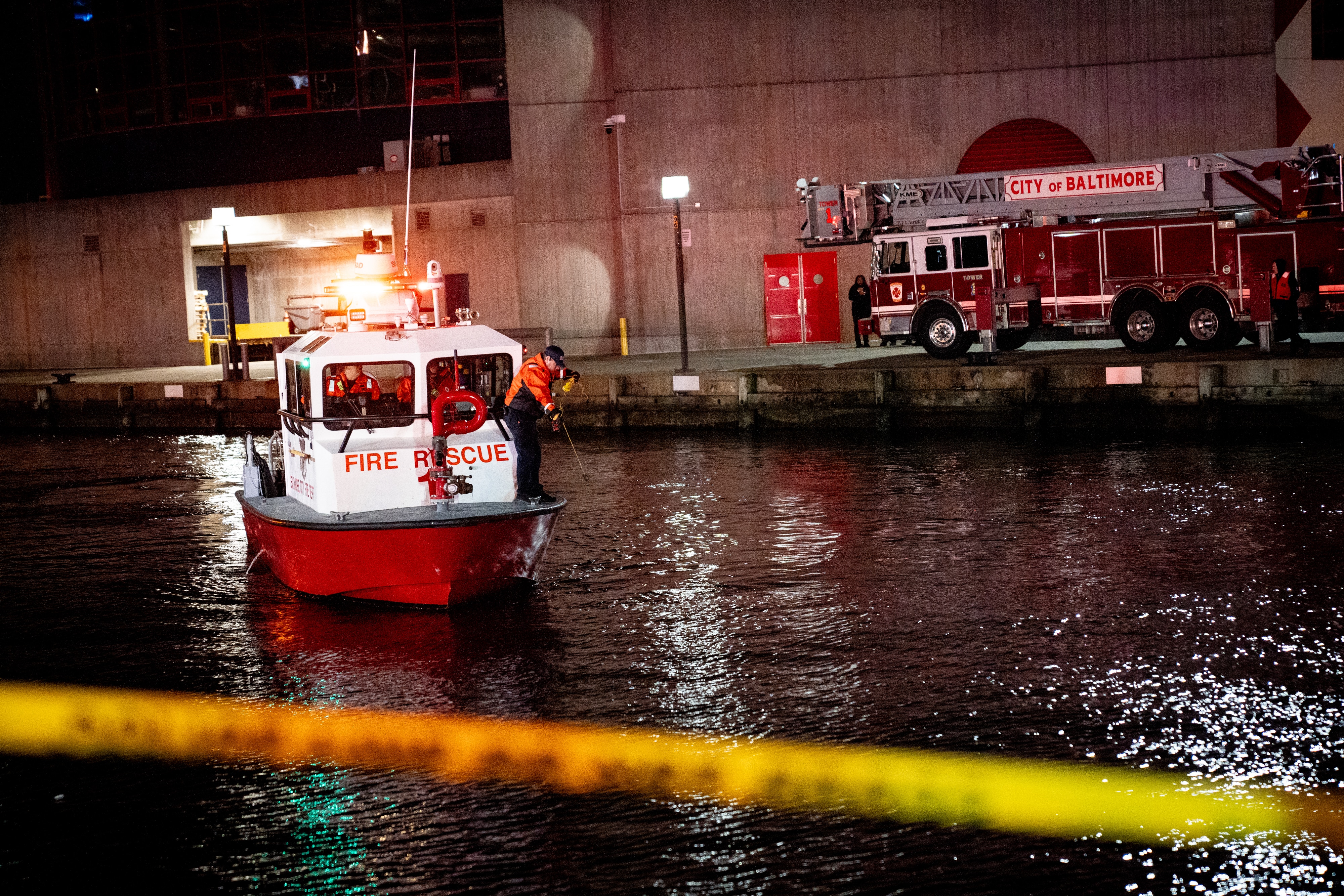 TUESDAY, NOVEMBER 18, 2025 - More than a dozen Baltimore fire trucks and police cars lined the area near the Pier 5 Hotel on Tuesday as divers and rescue boats searched for a vehicle that plunged into the water.