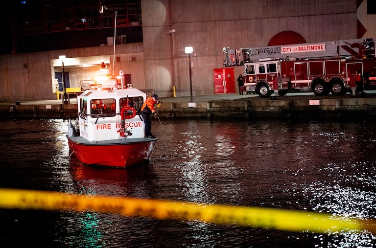 TUESDAY, NOVEMBER 18, 2025 - More than a dozen Baltimore fire trucks and police cars lined the area near the Pier 5 Hotel on Tuesday as divers and rescue boats searched for a vehicle that plunged into the water.