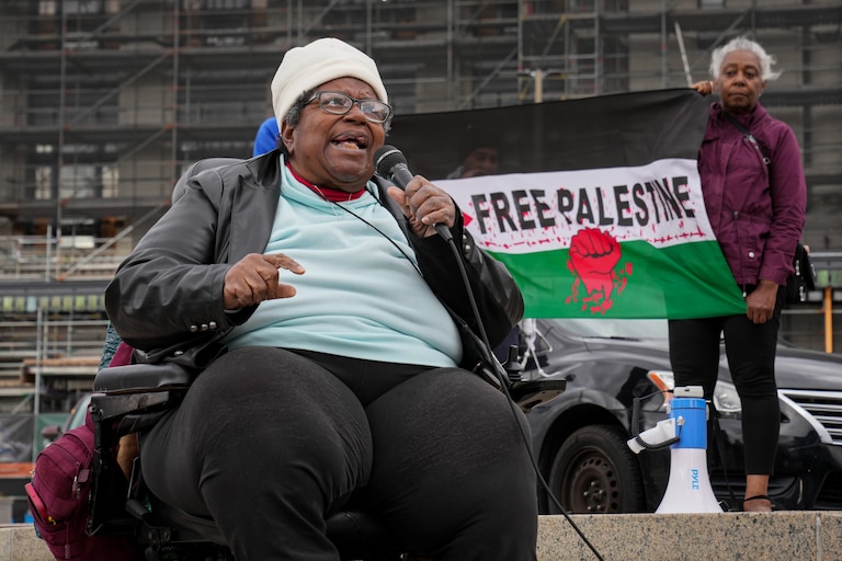 The Rev. Annie Chambers speaks with fellow protesters during a pro-Palestinian rally held in front of Penn Station on Saturday, October 21. The protest was organized by the Peoples Power Assembly.