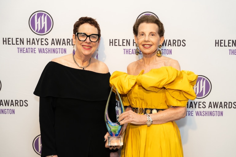 Step and repeat shot: Theatre Washington President and CEO Amy Austin (left) poses with philanthropist Adrienne Arsht (right), recipient of the Transformative cultural Impact Award, at the 2026 Helen Hayes Awards.