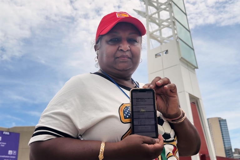 Bina Ramroop holds proof of the ticket she bought through StubHub for the World Cup Group H soccer match between Spain and Cape Verde in Atlanta on Monday, June 15, 2026. (AP Photo/Emilie Megnien)