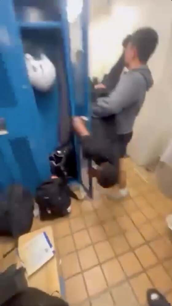 Screenshot from video showing Howard High JV football locker room incident that led to charges.