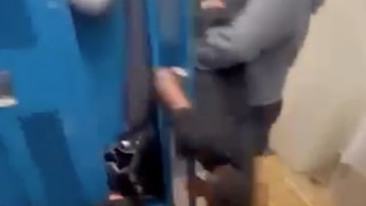 Screenshot from video showing Howard High JV football locker room incident that led to charges.