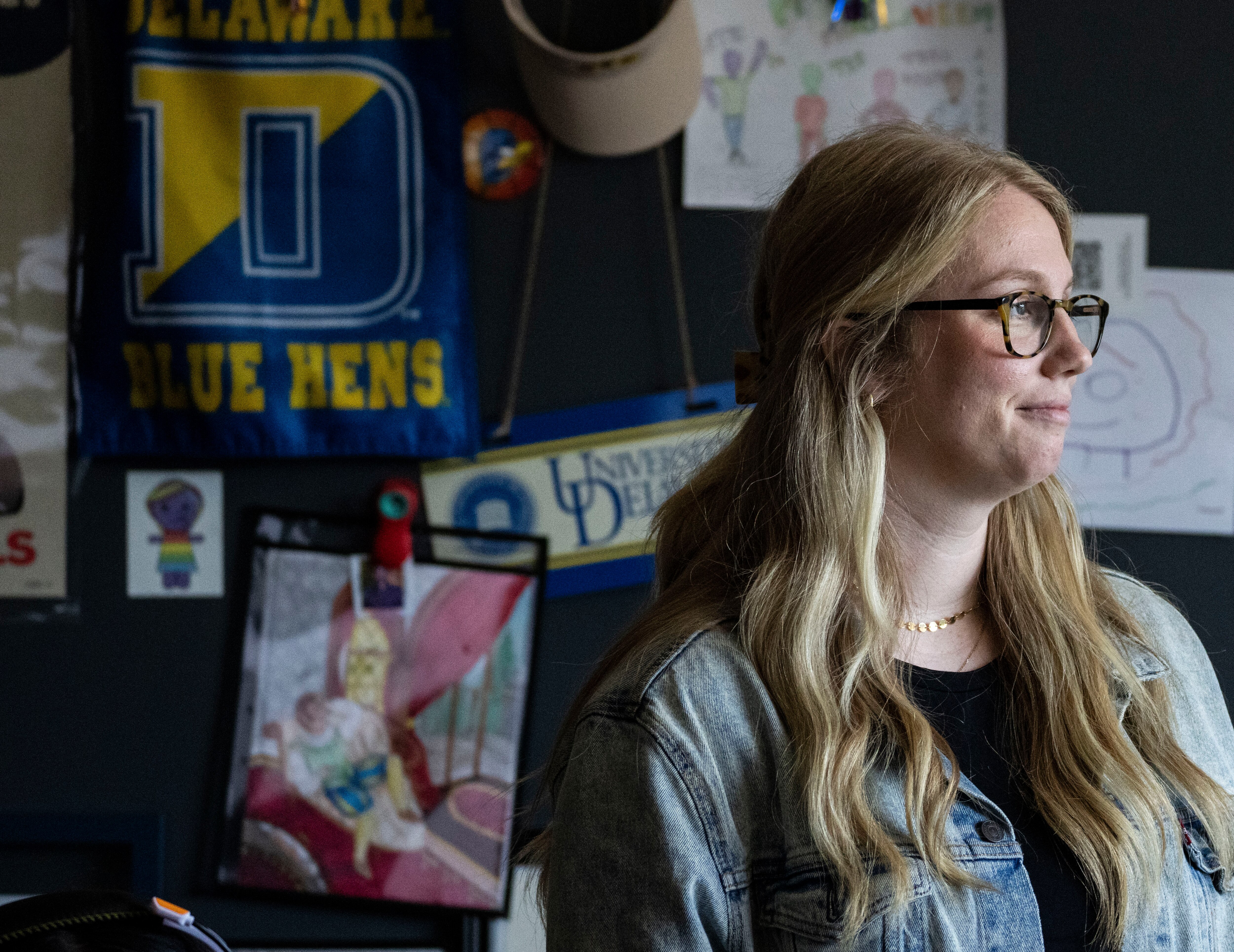 Kate Locke Jones, a seventh grade English teacher poses for a portrait inside of her classroom at Hampstead Hill Academy, May 22, 2024.