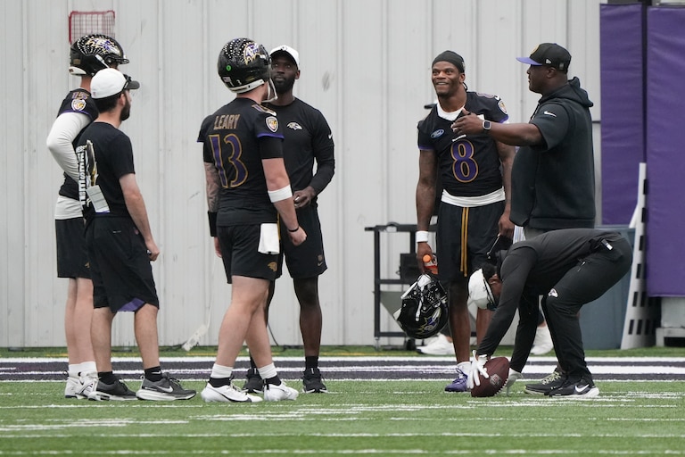 Baltimore Ravens quarterback Lamar Jackson (8) speaks with quarterbacks coach Tee Martin and backup quarterbacks during the team’s mandatory minicamp at the Under Armour Performance Center in Owings Mills, Md. on Wednesday, June 18, 2025.