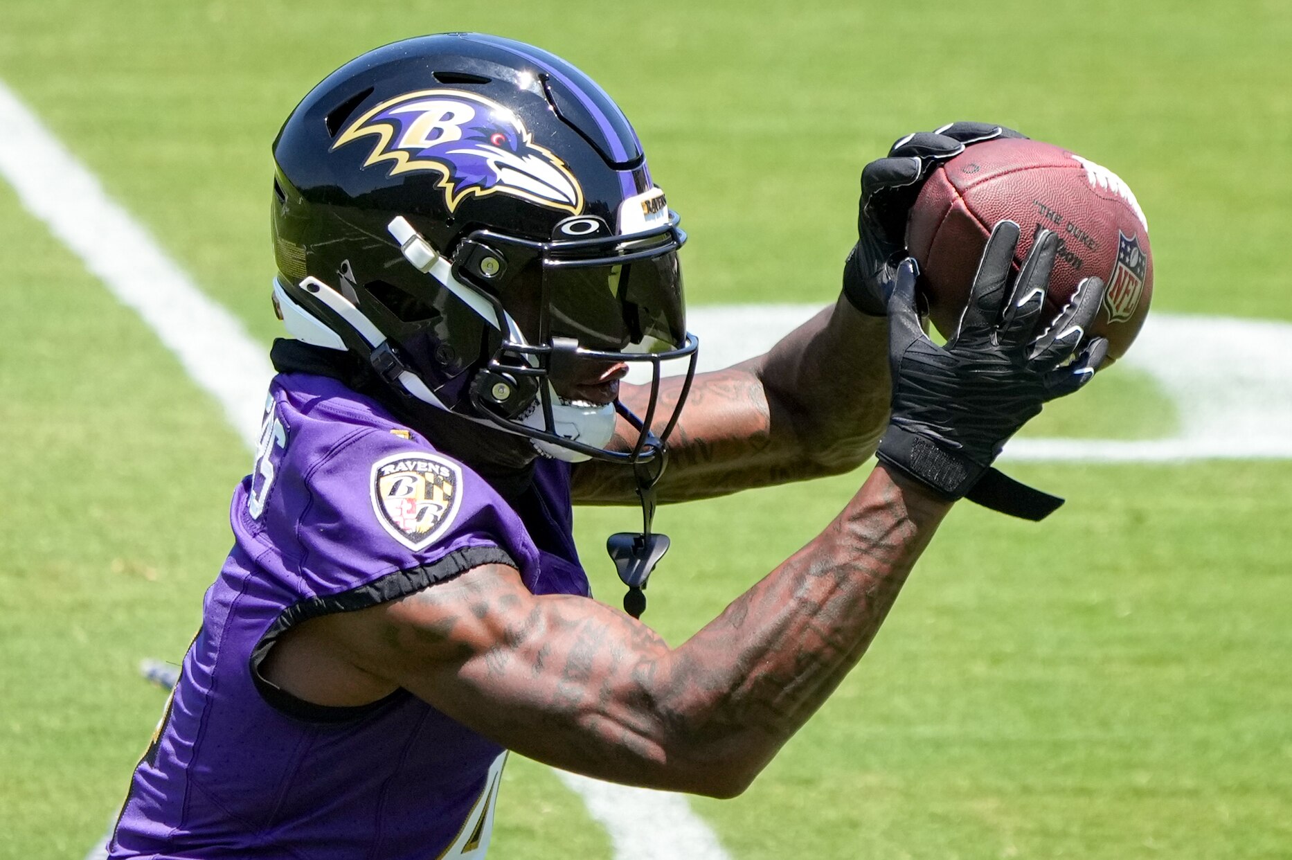 Ravens receiver Zay Flowers catches a pass Wednesday during organized team activities.
