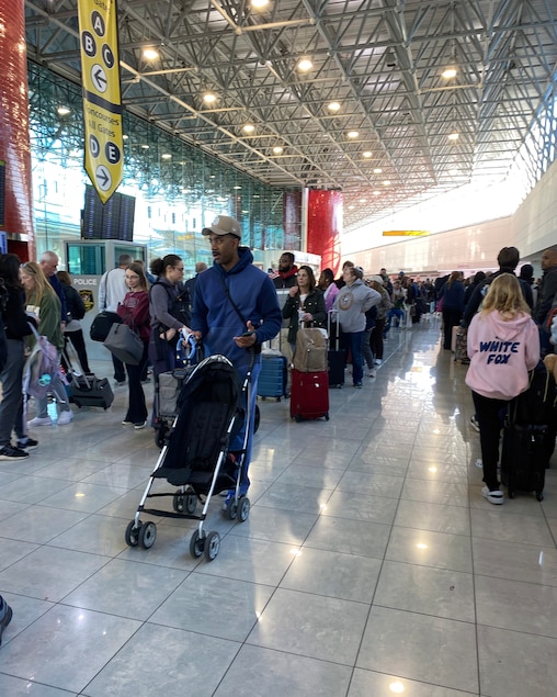 SATURDAY, MARCH 28, 2026 - Travelers wind through Baltimore/Washington International Thurgood Marshall Airport in hours-long lines as they near security on Saturday morning.