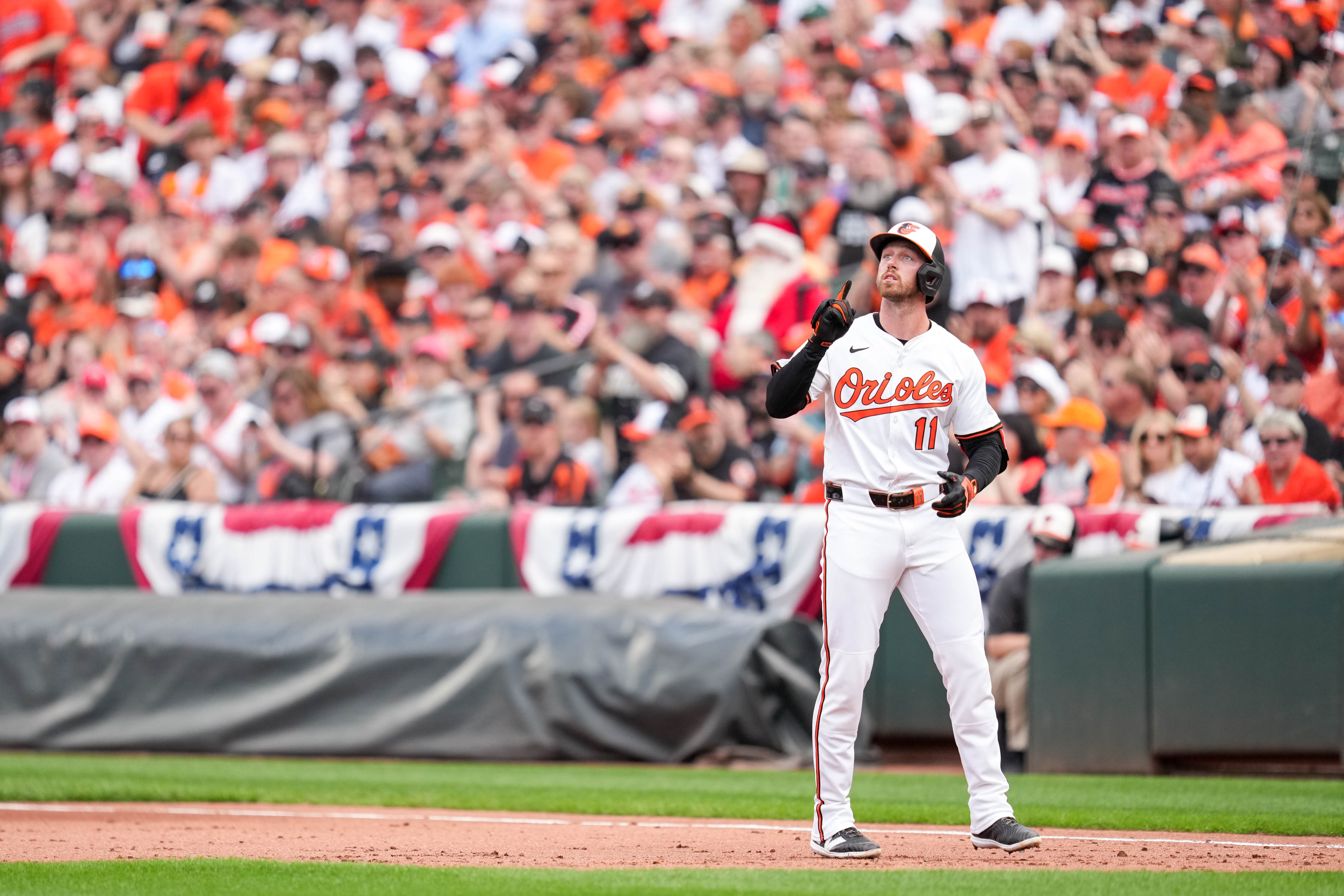 Jordan Westburg (11) points to the sky after singling in the Orioles' home opener.