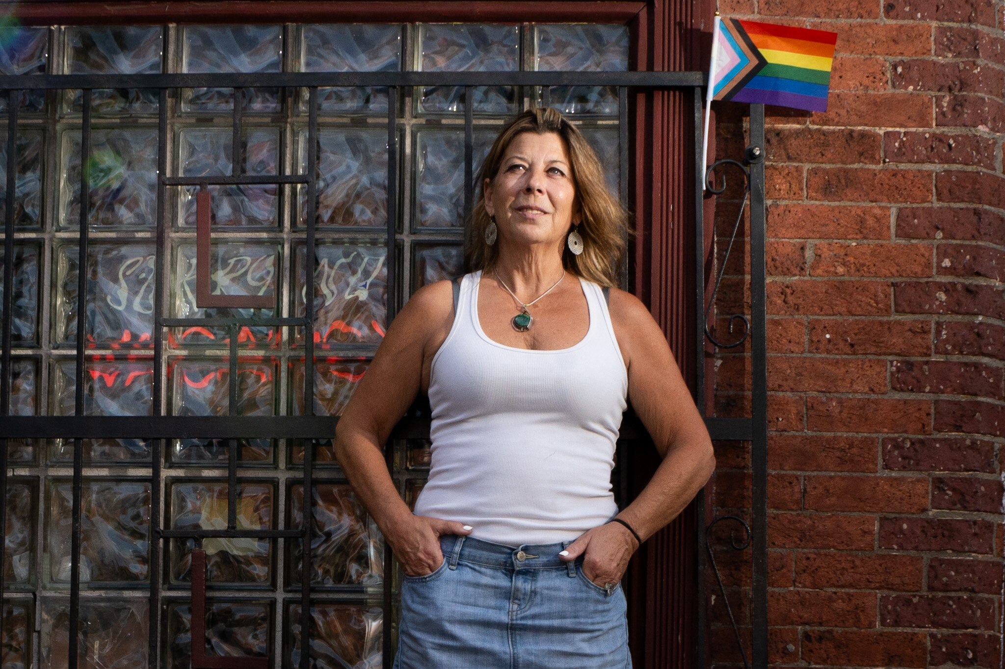 Straight ally Karen Dugan poses for a portrait outside of Leon’s Backroom Bar on July 3, 2024.