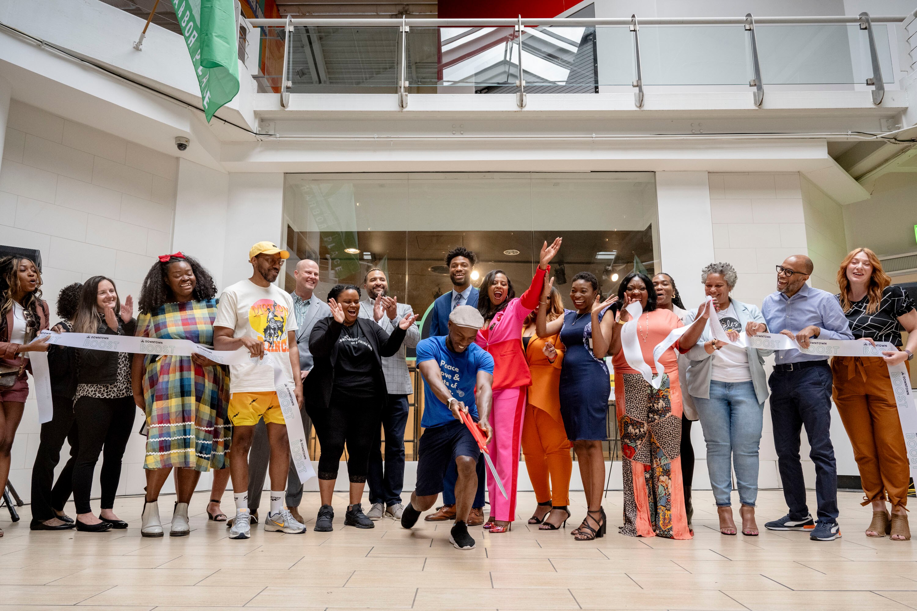Representatives of the seven Black-owned businesses in the Downtown Partnership's latest BOOST initiative participate in a ribbon cutting ahead of a planned opening next month.