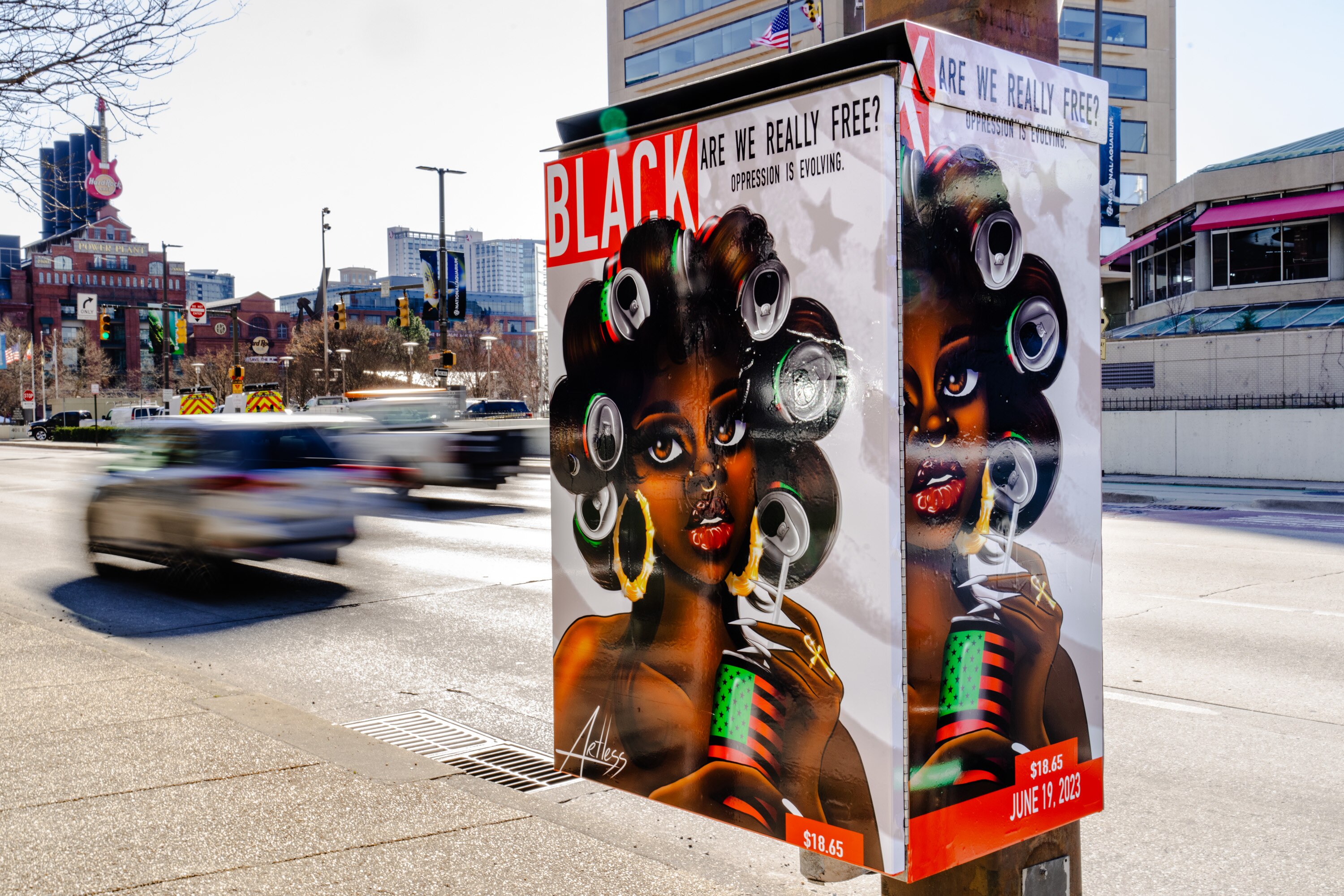 Art from Brianna McKay, one of the winners of the "Wrap the Box" contest, is seen on an electrical light box at Pratt and South streets.