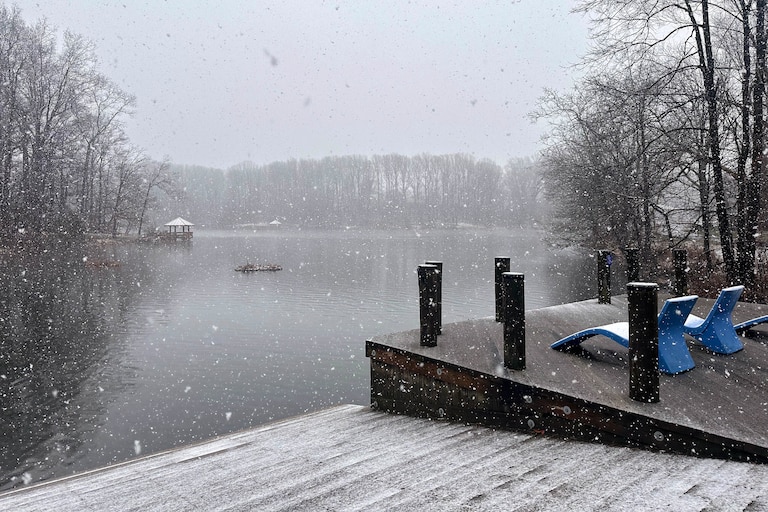 MARCH 12, 2026 - A fresh blanket of snow covered the boat launch and lounge chairs at Lake Elkhorn in Howard County on March 12, 2026.