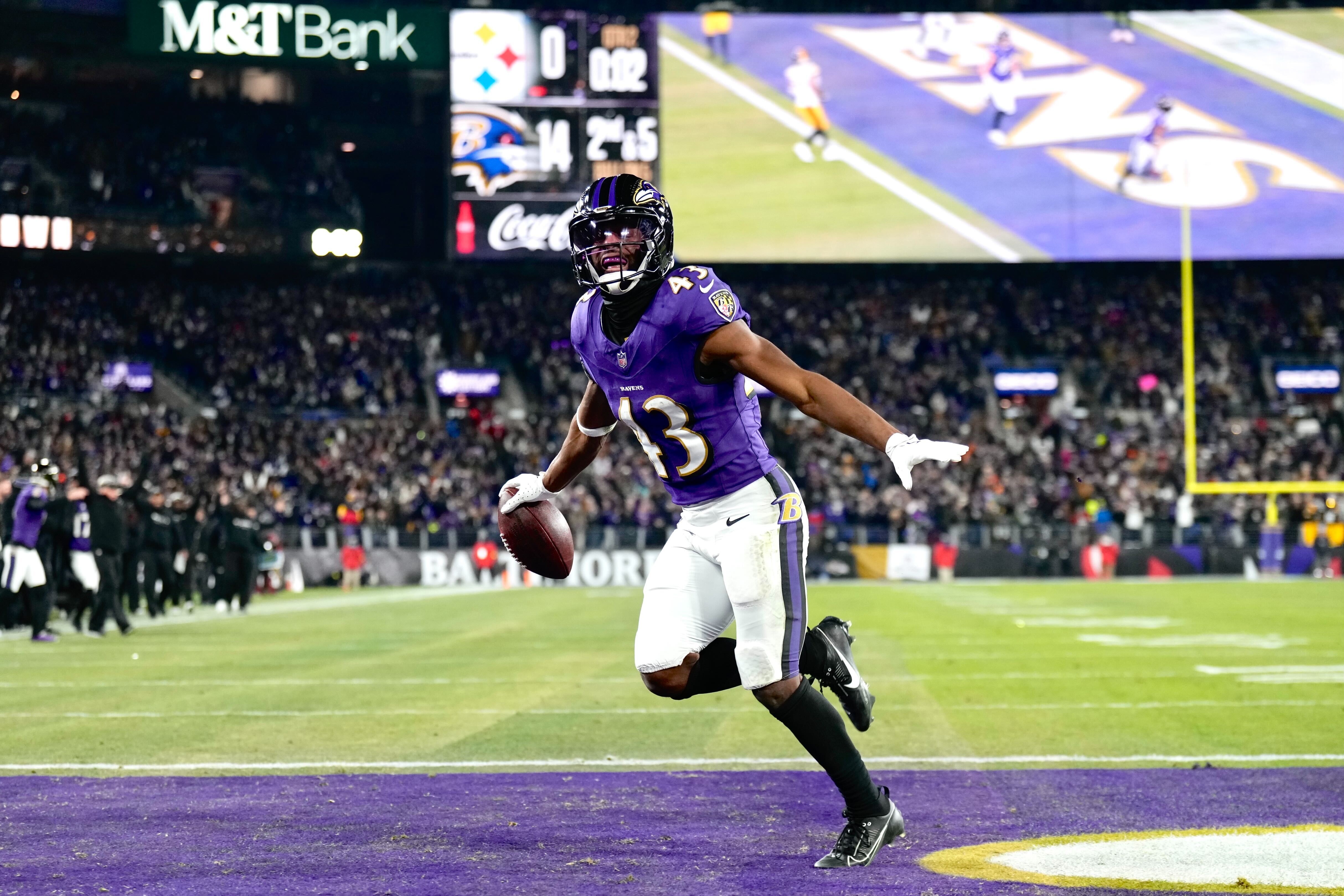 Ravens running back Justice Hill celebrates after scoring a touchdown at the end of the second quarter of Saturday’s game against the Pittsburgh Steelers at M&T Bank Stadium in Baltimore on January 11, 2025.