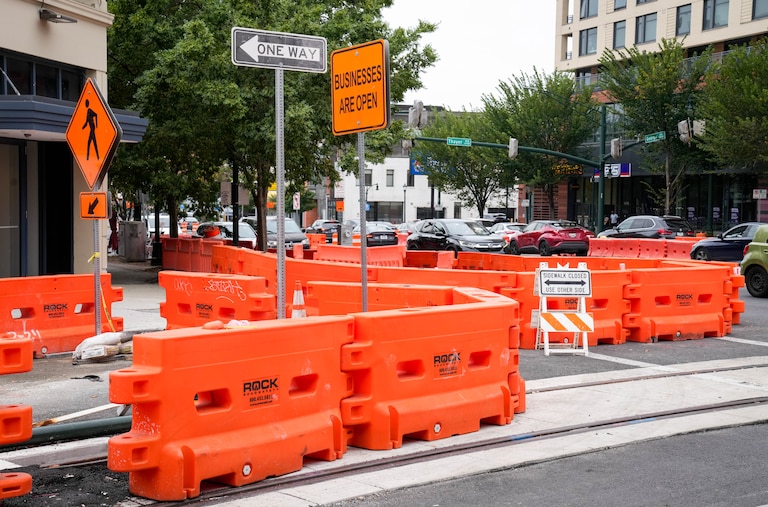 Signage reminds pedestrians that businesses are open as Purple Line construction continues on Bonifant St. in Silver Spring, Md., on Wednesday, Sept. 24, 2025.