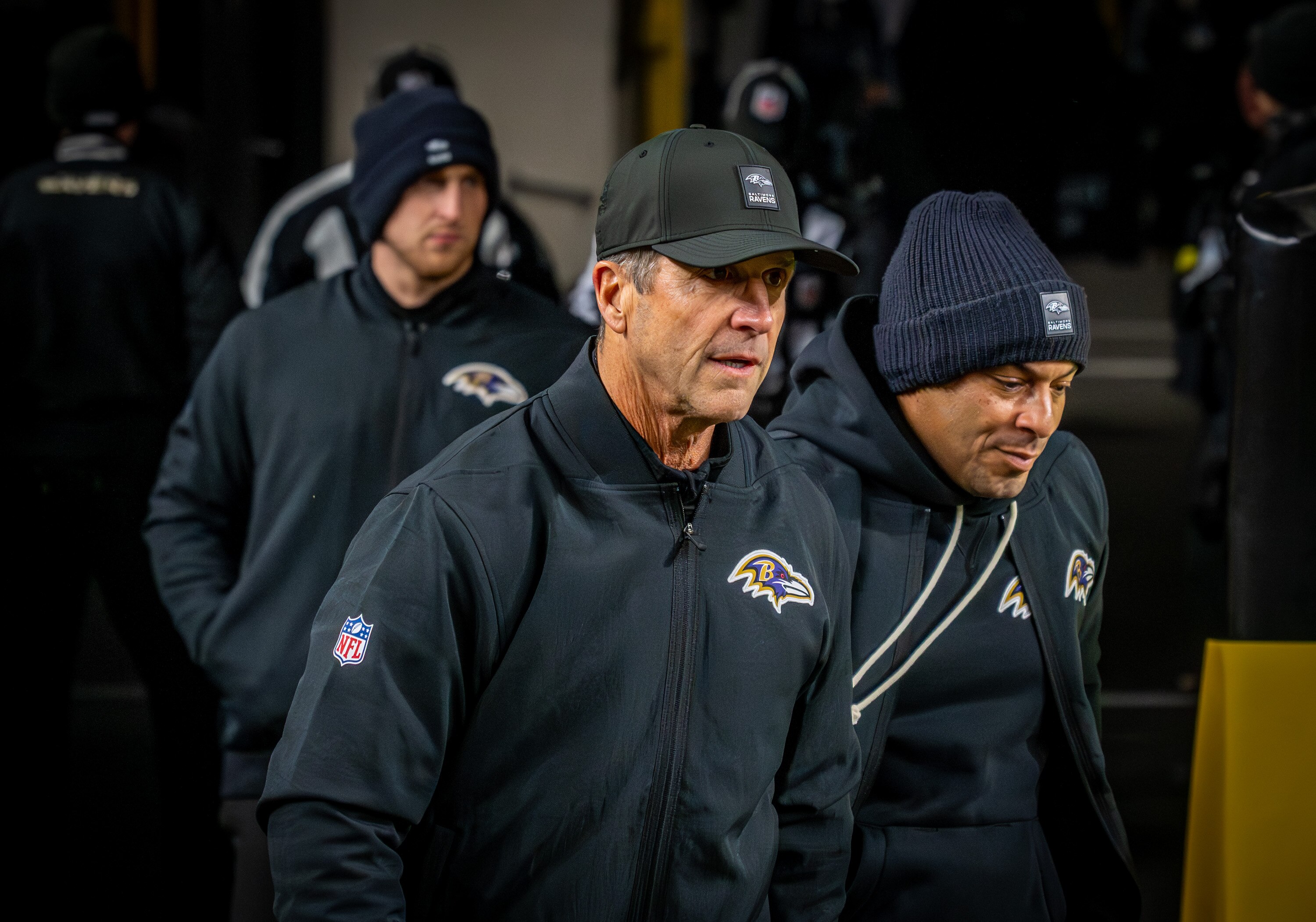 Baltimore Ravens head coach John Harbaugh takes the field during warmups as the Ravens prepare to play the Steelers on Sunday.