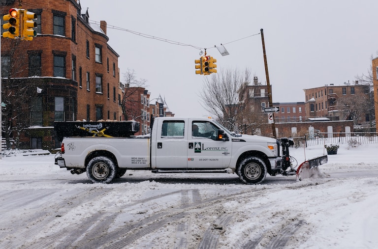 Private snow removal companies assist with plowing in Reservoir Hill, Baltimore, MD, on Jan 6. 2024.