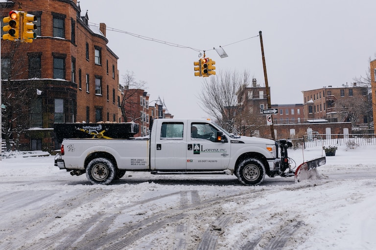 Private snow removal companies assist with plowing in Reservoir Hill, Baltimore, MD, on Jan 6. 2024.