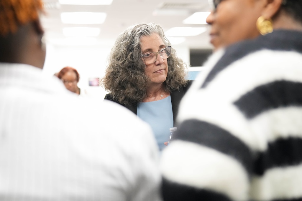 Shawn McIntosh, a Democratic candidate for Wade Kach’s seat on the Baltimore County Council, speaks with guests at an Emerge Maryland alumni event at the Maryland State Education Association on Tuesday, February 17, 2026.