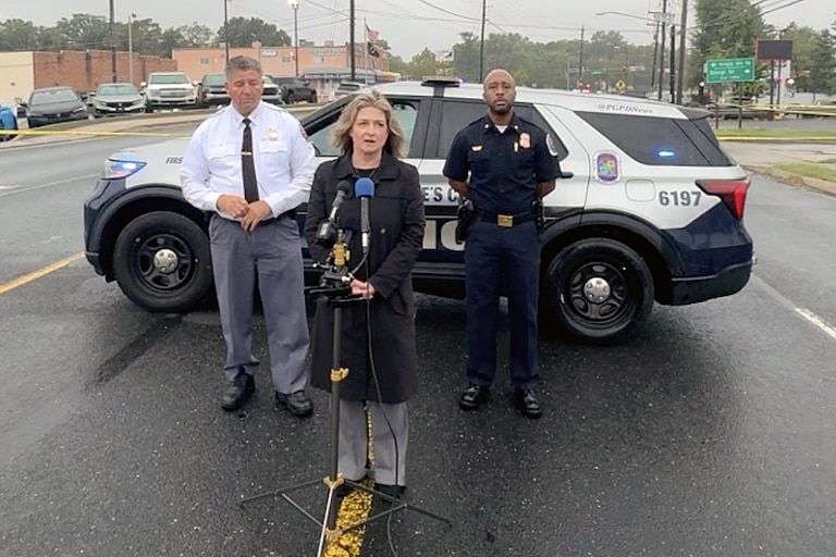 TUESDAY, SEPTEMBER 22, 2026 - Prince George's County Police Department's acting manager of media relations Christina Cotterman, center, and Deputy Chief James Keleti, left, provide an update on the investigation into a Tuesday morning shooting and suspected suicide.