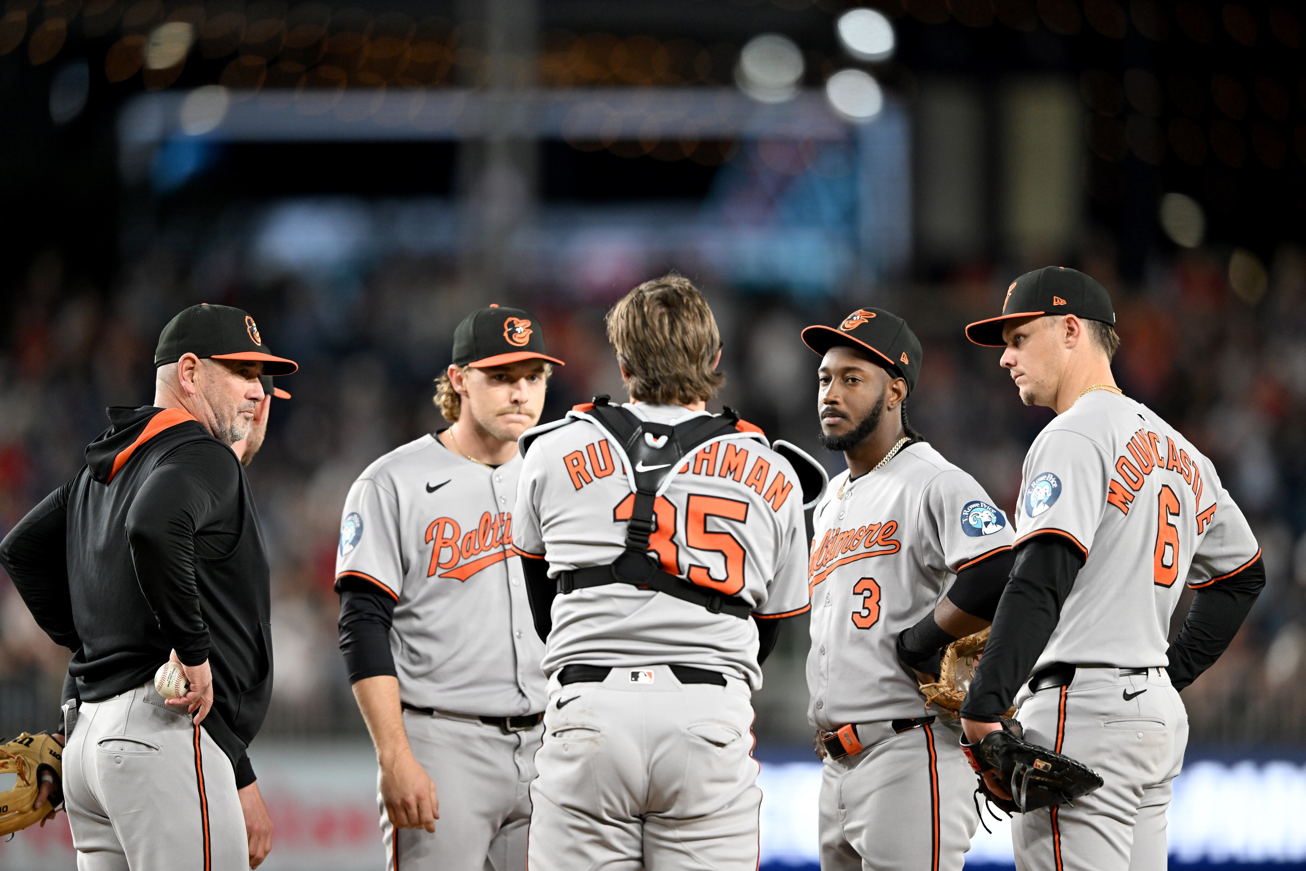 WASHINGTON, DC - APRIL 24: Manager Brandon Hyde #18 of the Baltimore Orioles talks to his players during a pitching change in the seventh inning against the Washington Nationals at Nationals Park on April 24, 2025 in Washington, D.C.