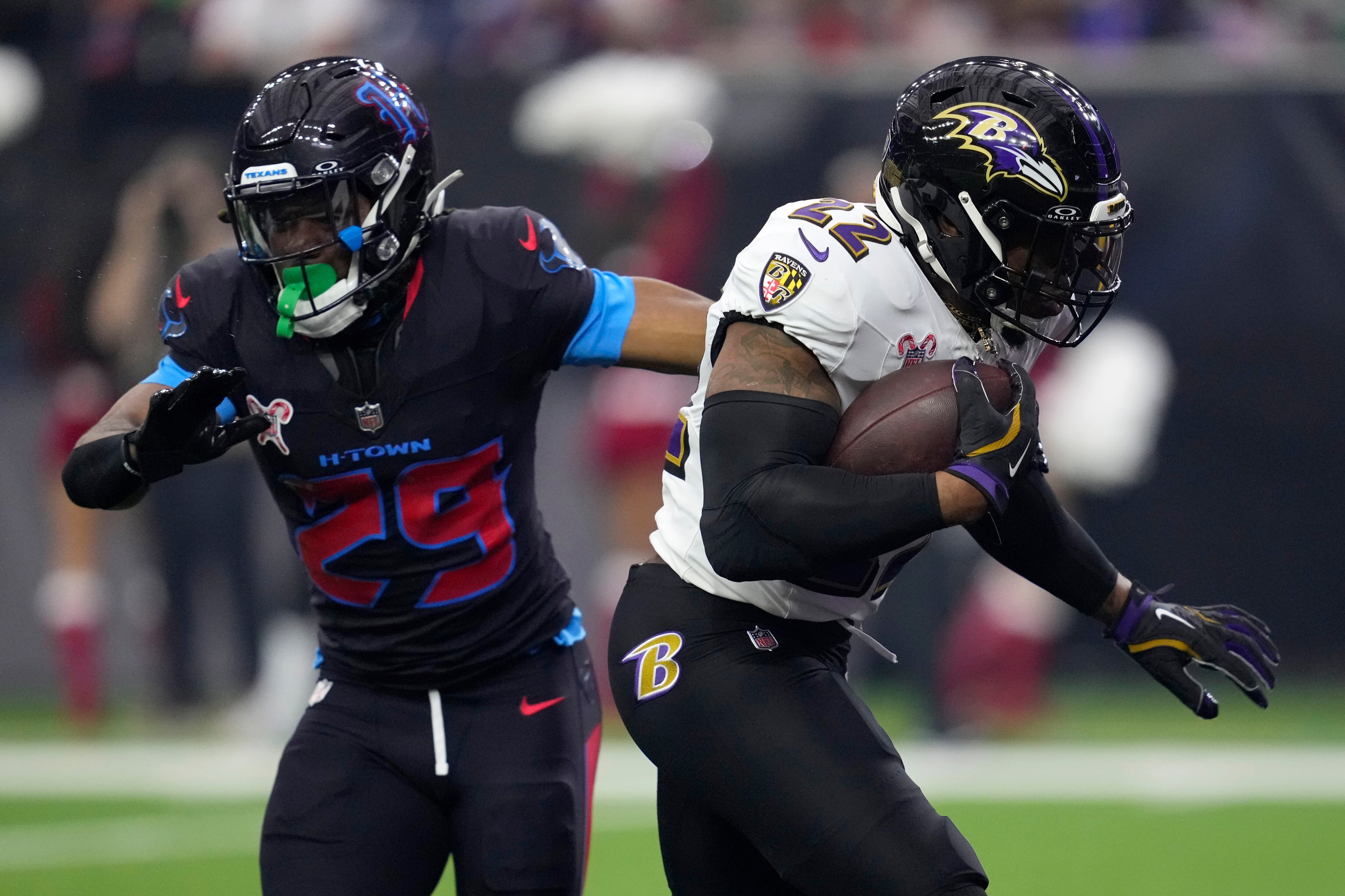 Ravens running back Derrick Henry scores on a 2-yard run on the team’s opening drive Wednesday against the Texans.