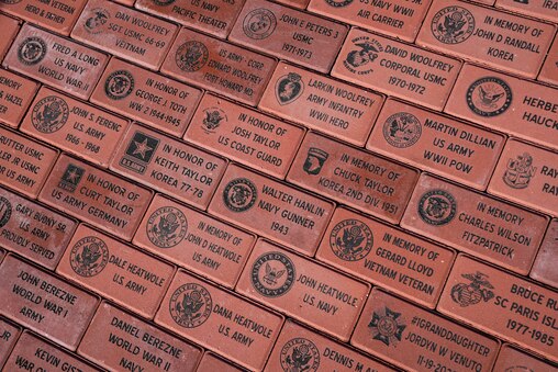 Veterans’ names are seen on bricks on a new memorial in Veterans Memorial Park, just outside of Wells-McComas VFW Post 2678, during a Veterans Day observance ceremony in Sparrows Point, Md., on Tuesday, November 11, 2025.