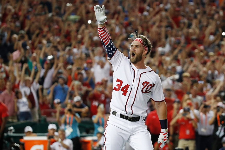 FILE - Washington Nationals Bryce Harper reacts to his winning hit during the 2018 Home Run Derby in Washington.