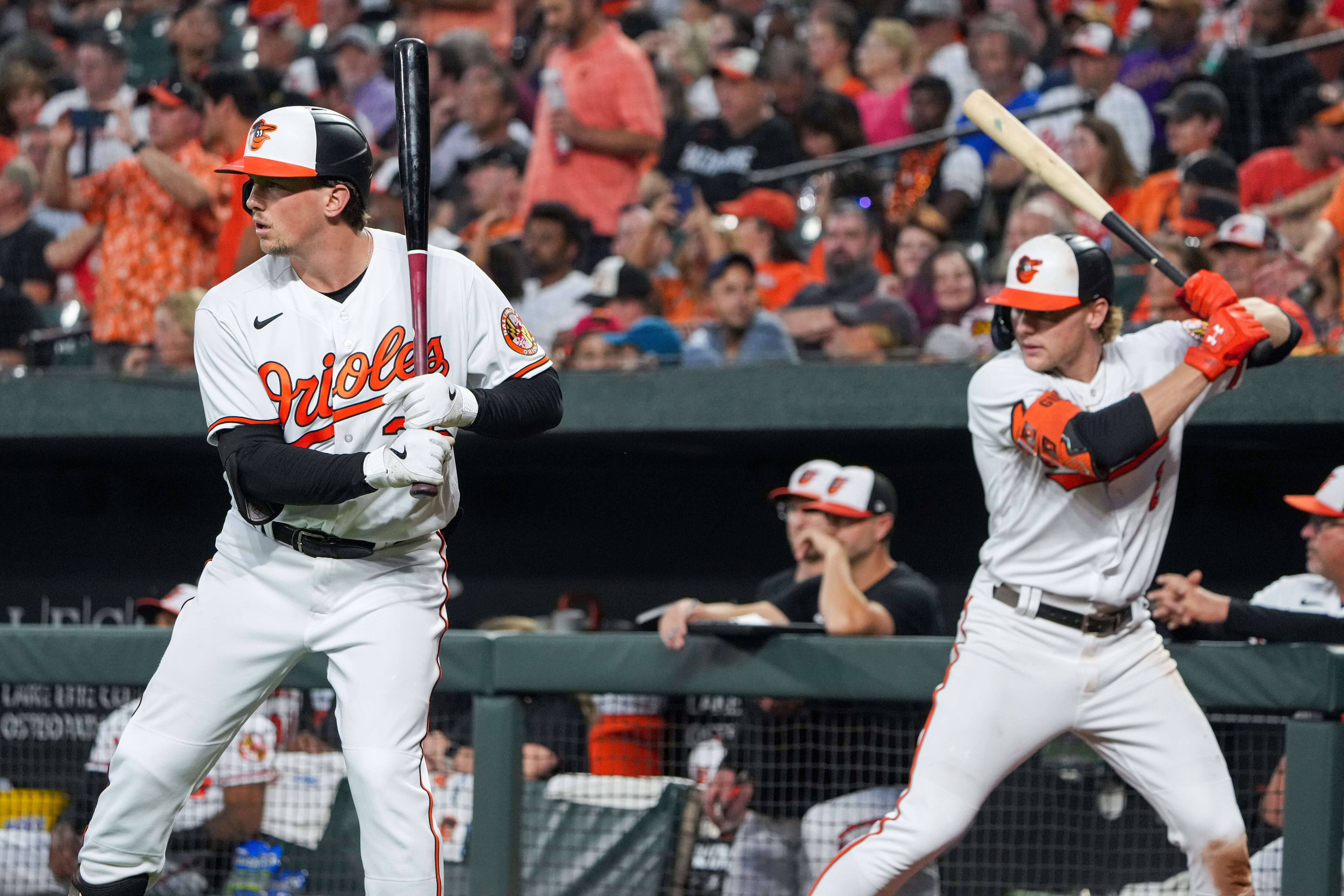 Adley Rutschman, left, and Gunnar Henderson have high-dollar contracts in their future. The question is who will be paying them.