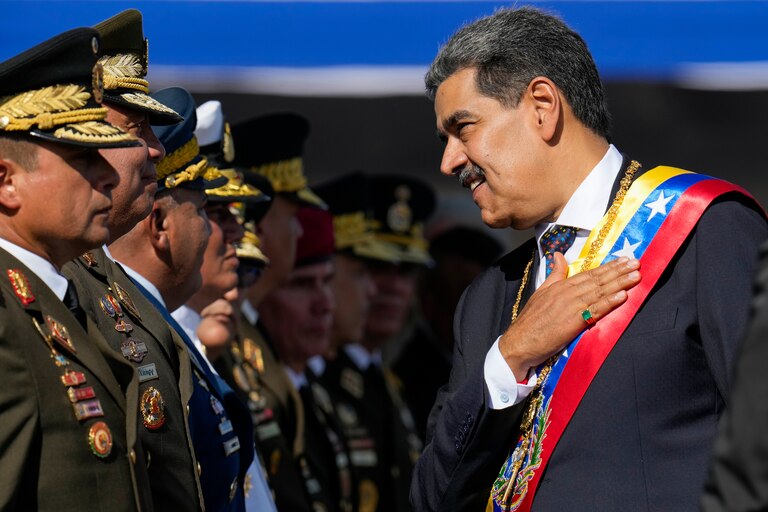FILE - Venezuela's President Nicolas Maduro places his hand over his heart while talking to high-ranking officers during a military ceremony on his inauguration day for a third term, in Caracas, Venezuela, Jan. 10, 2025.