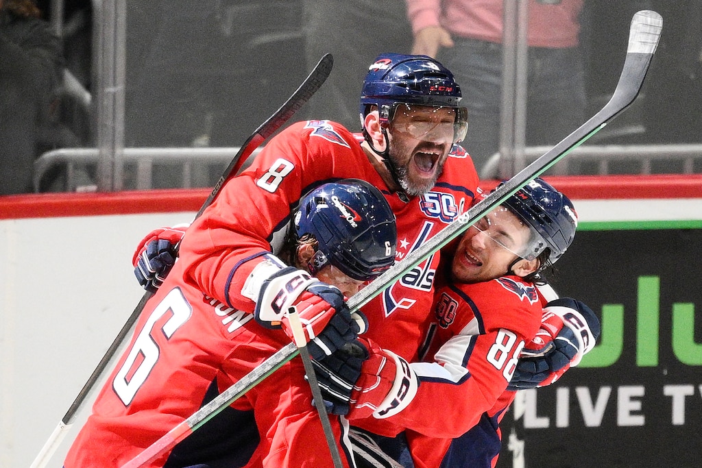 Washington Capitals left wing Alex Ovechkin (8) celebrating his 894th career NHL goal with teammates during the third period of an NHL hockey game against the Chicago Blackhawks, Friday, April 4, 2025, in Washington.