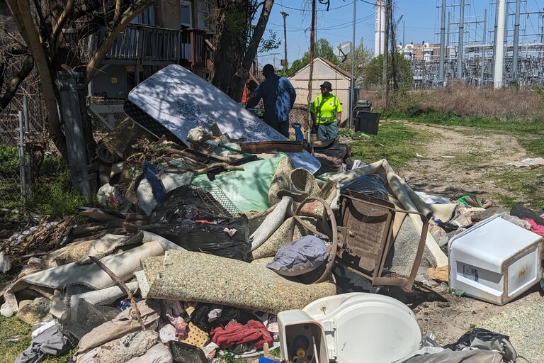 DPW tackles a pile of debris behind a home in Westport.