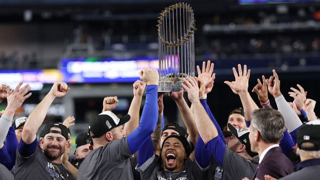 NEW YORK, NEW YORK - OCTOBER 30:  Mookie Betts #50 of the Los Angeles Dodgers celebrates with the trophy after the Dodgers defeated the New York Yankees 7-6 in game 5 to win the 2024 World Series at Yankee Stadium on October 30, 2024 in the Bronx borough of New York City. (Photo by Elsa/Getty Images)
