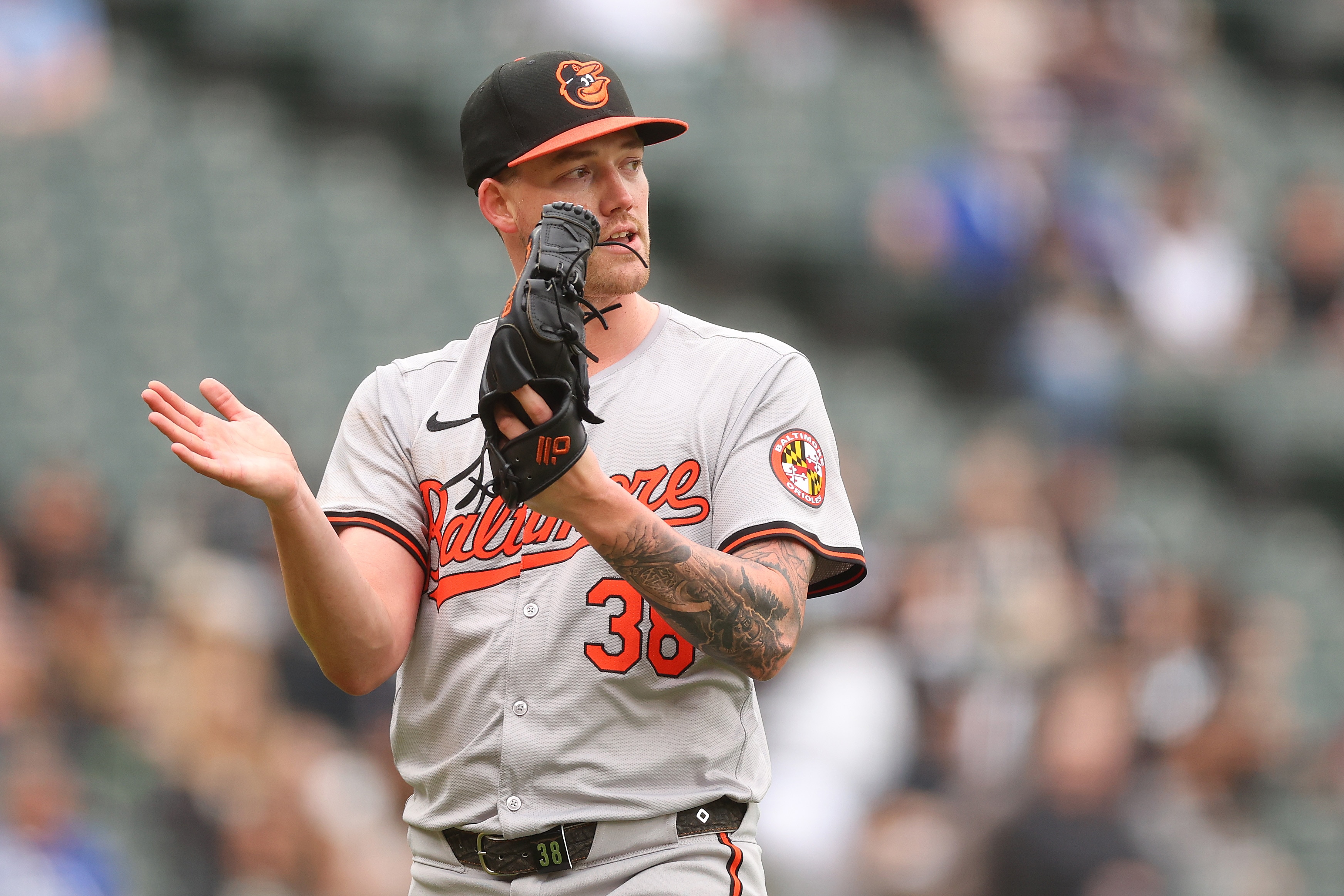 Kyle Bradish #38 of the Baltimore Orioles reacts to a play during the fifth inning against the Chicago White Sox at Guaranteed Rate Field.