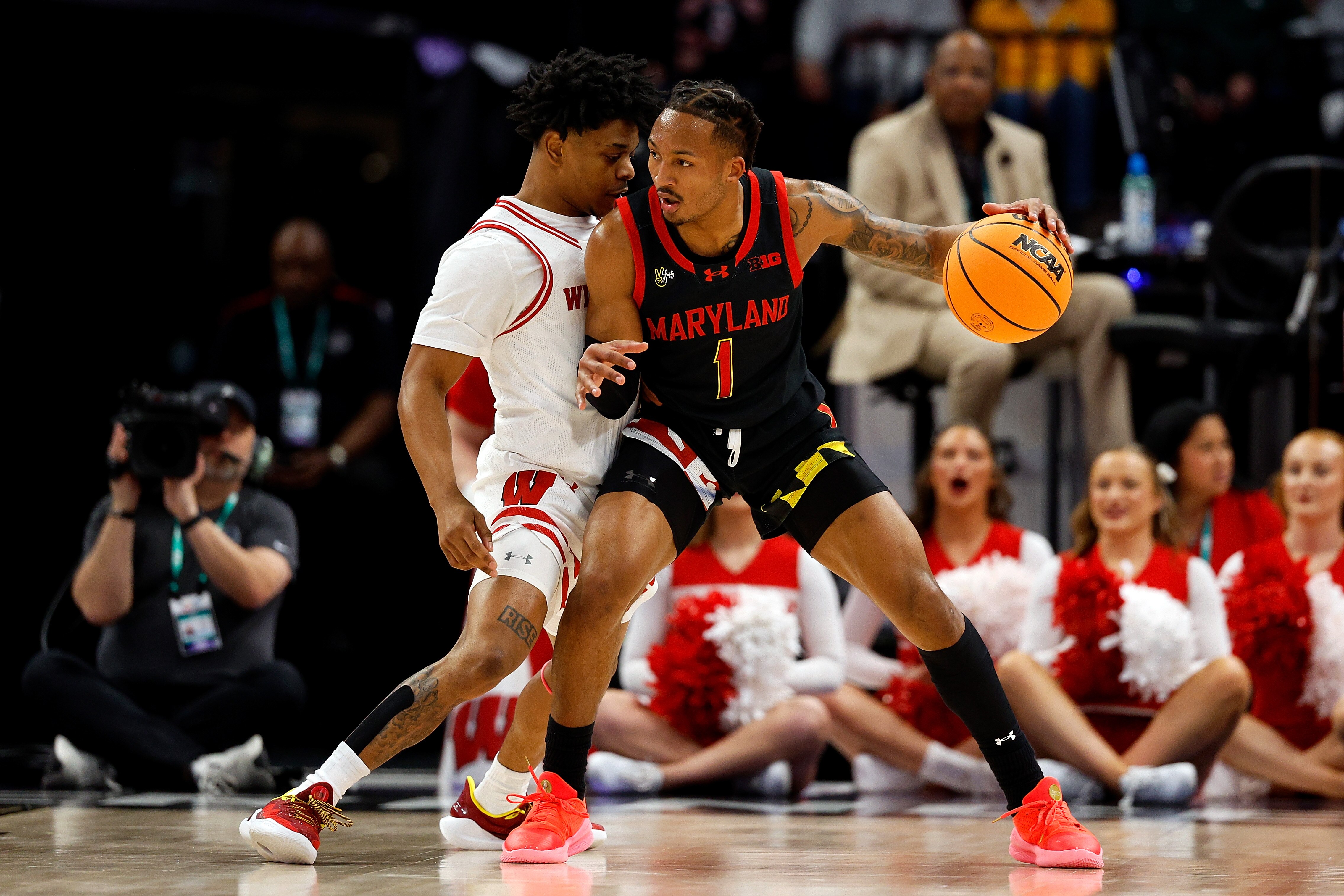 Jahmir Young of Maryland collides with Kamari McGee of Wisconsin during the first half Thursday in Minneapolis.
