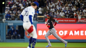 Washington Nationals' CJ Abrams, right, rounds the bases after hitting a solo home run during the fourth inning of a baseball game against the Los Angeles Dodgers in Los Angeles, Sunday, Sept. 6, 2026. (AP Photo/Kyusung Gong)