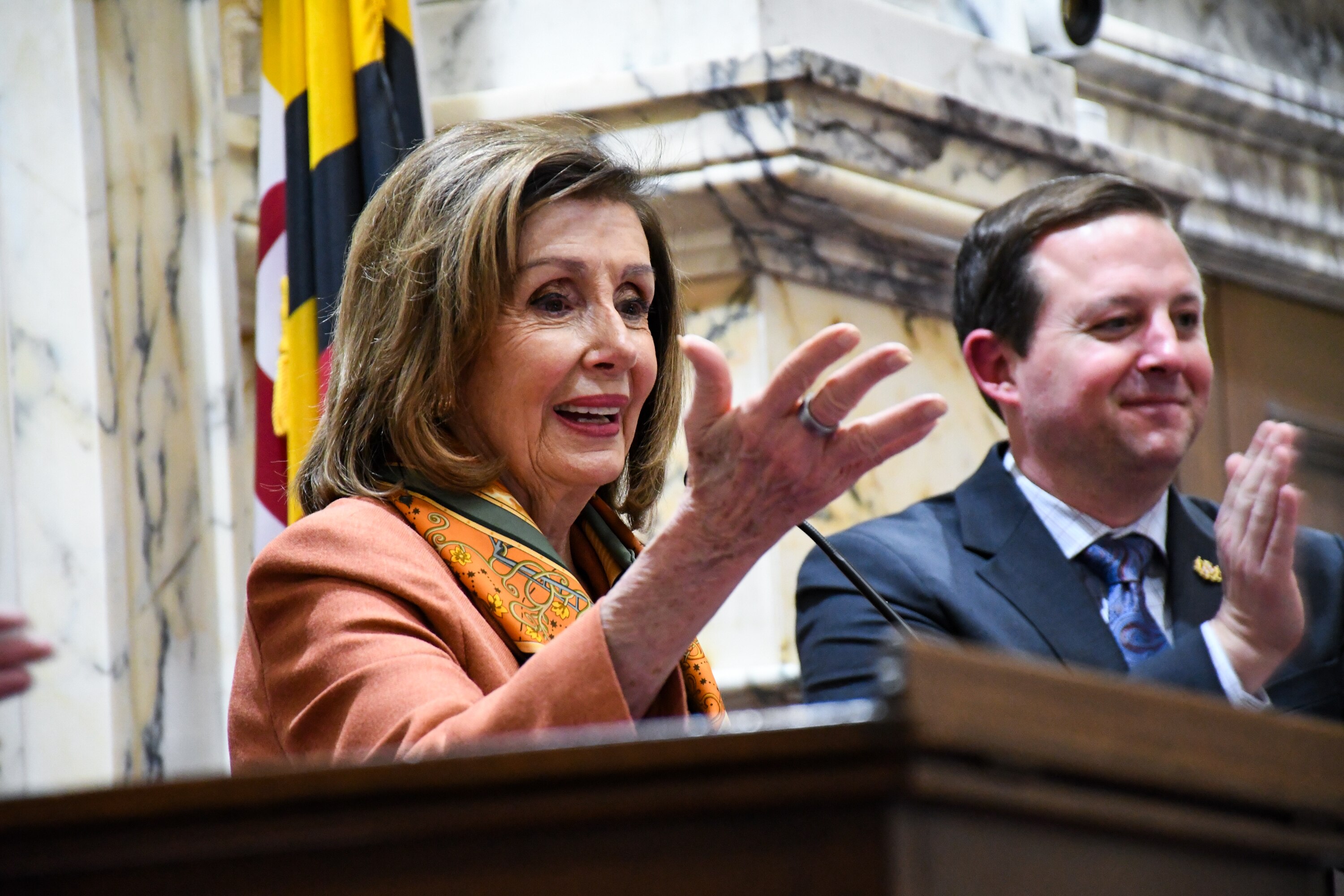 U.S. House of Representatives Speaker Emerita Nancy Pelosi, standing with Maryland Senate President Bill Ferguson, addresses the Maryland Senate after being honored with an award on Monday. 