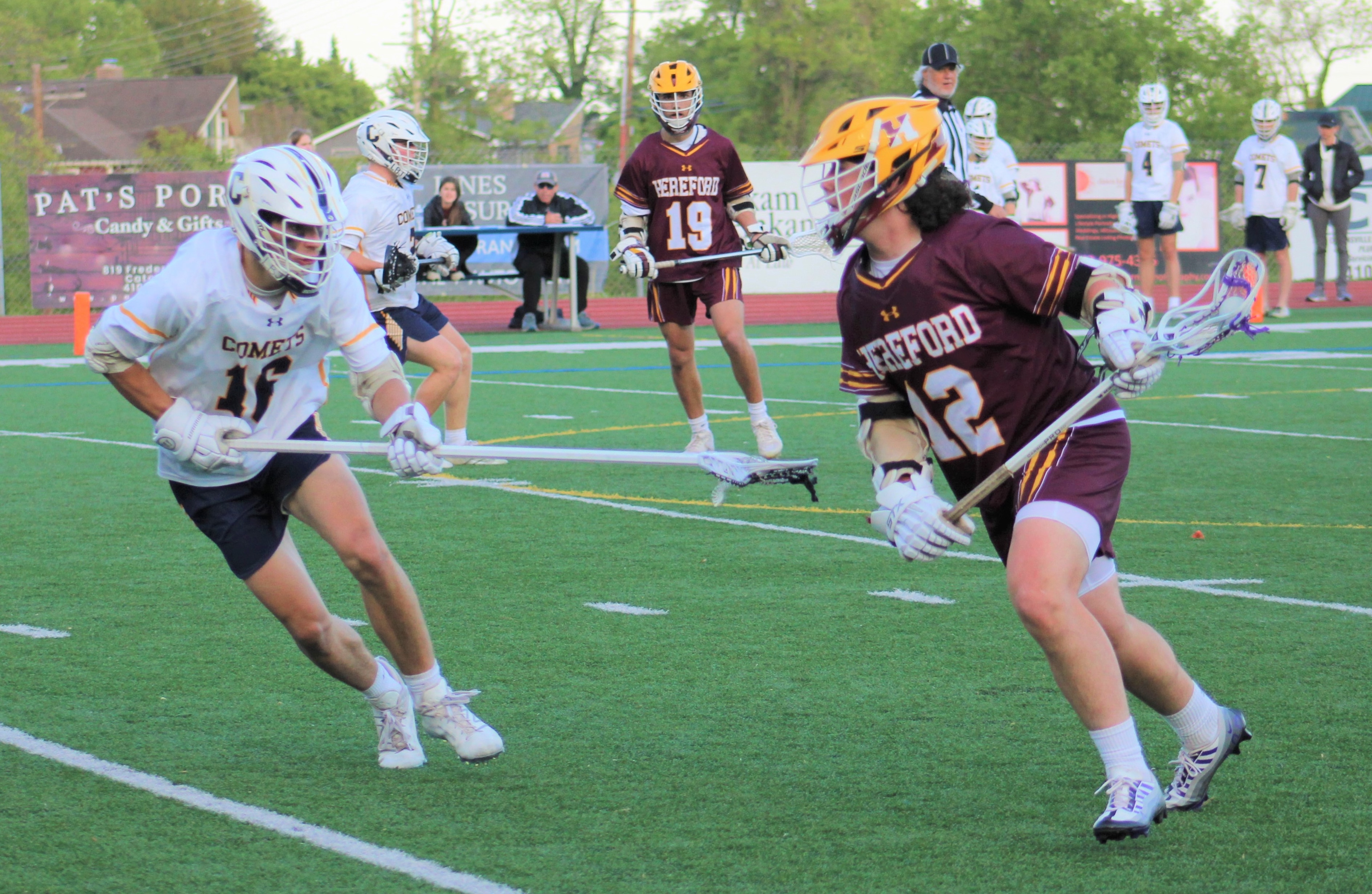 Hereford's Baylor Davis goes on the attack against Catonsville defensemen William Robertson during the third quarter of Monday's Baltimore County boys lacrosse contest. Davis scored all five of his goals in the first half as the Bulls defeated the host Comets, 15-4, in a rematch of last spring's Baltimore County final.