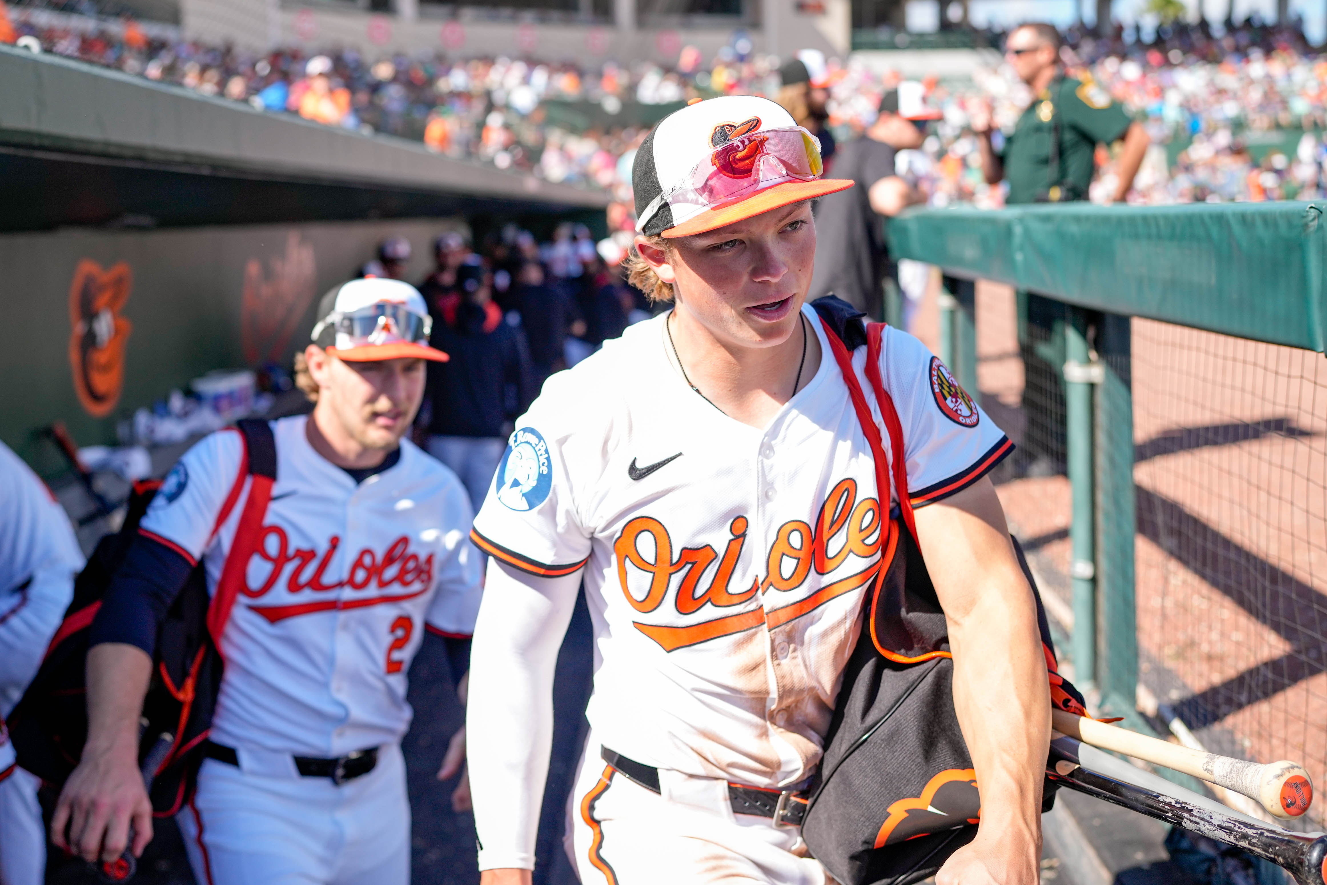 Baltimore Orioles second baseman Jackson Holliday and shortstop Gunnar Henderson leave a Grapefruit League game against the Detroit Tigers in February.