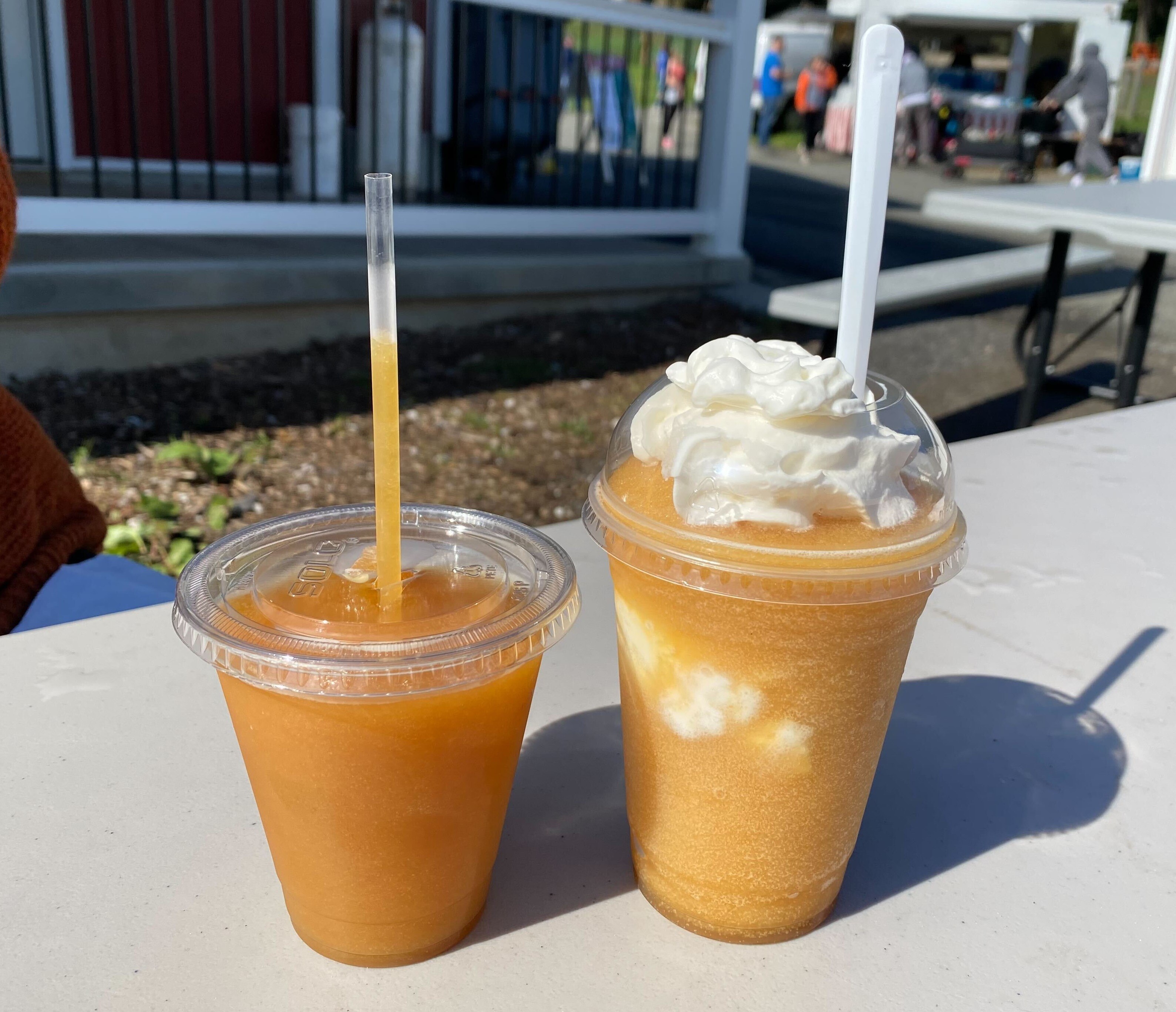 An apple cider slush ($3), left, and an apple cider creamsicle ($6) at Weber's Cider Mill Farm in Parkville.