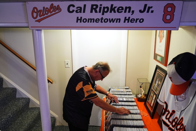 Orioles fan Rick Taylor looks through his collection of tickets from almost every baseball game of Cal Ripken Jr.'s 2,632 game "Iron Man" streak.