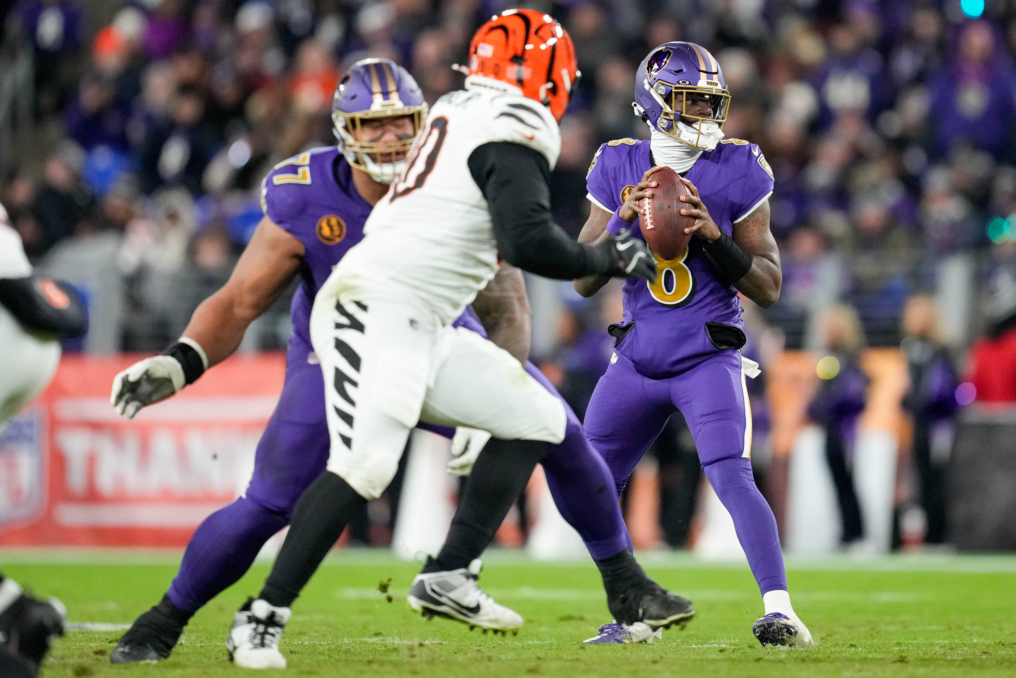 Baltimore Ravens quarterback Lamar Jackson (8) drops back to pass in the fourth quarter of a game against the Cincinnati Bengals on Thanksgiving at M&T Bank Stadium in Baltimore, Md., on Thursday, November 27, 2025.