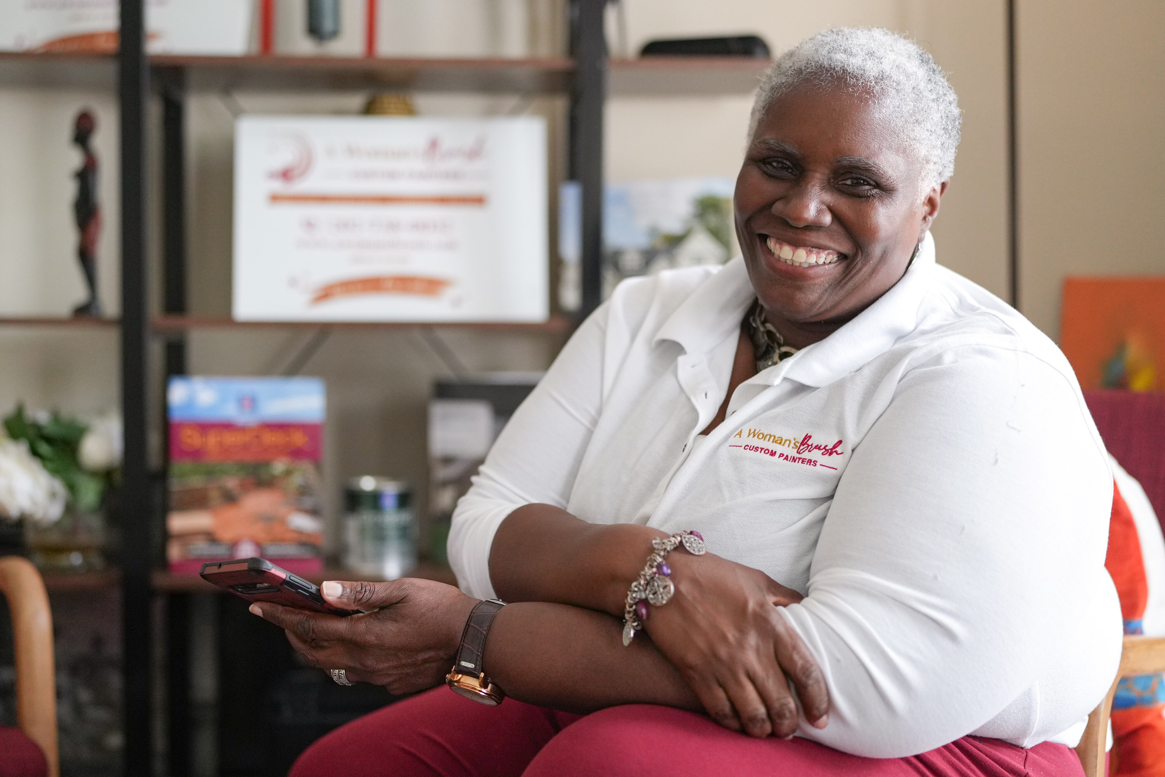 Val Traore, owner of A Woman’s Brush, poses for a portrait in her company’s Columbia office on June 27, 2024.