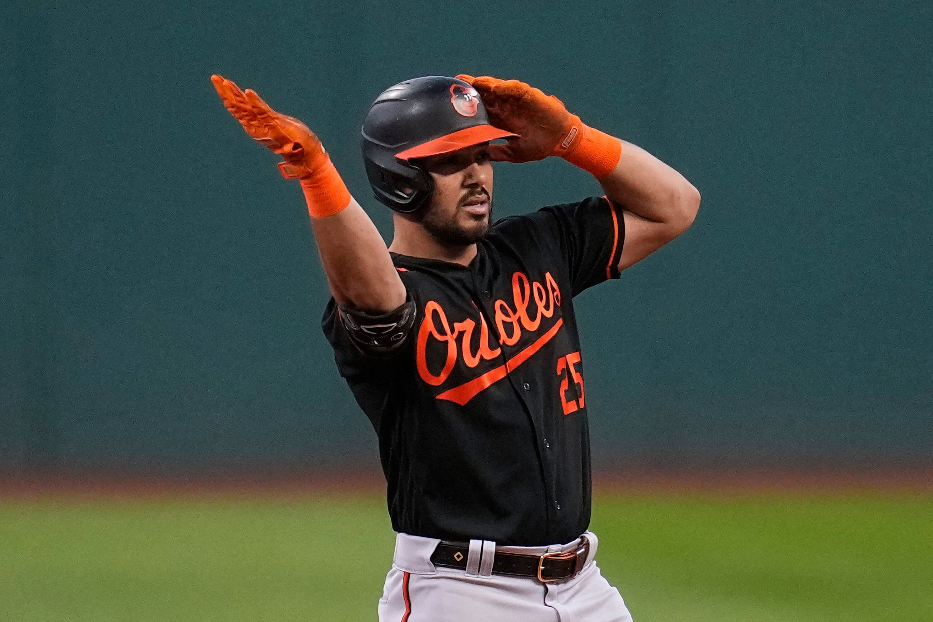 Baltimore Orioles' Anthony Santander gestures from second base after hitting a double against the Baltimore Orioles during the first inning of a baseball game Friday, Sept. 22, 2023, in Cleveland. (AP Photo/Sue Ogrocki)