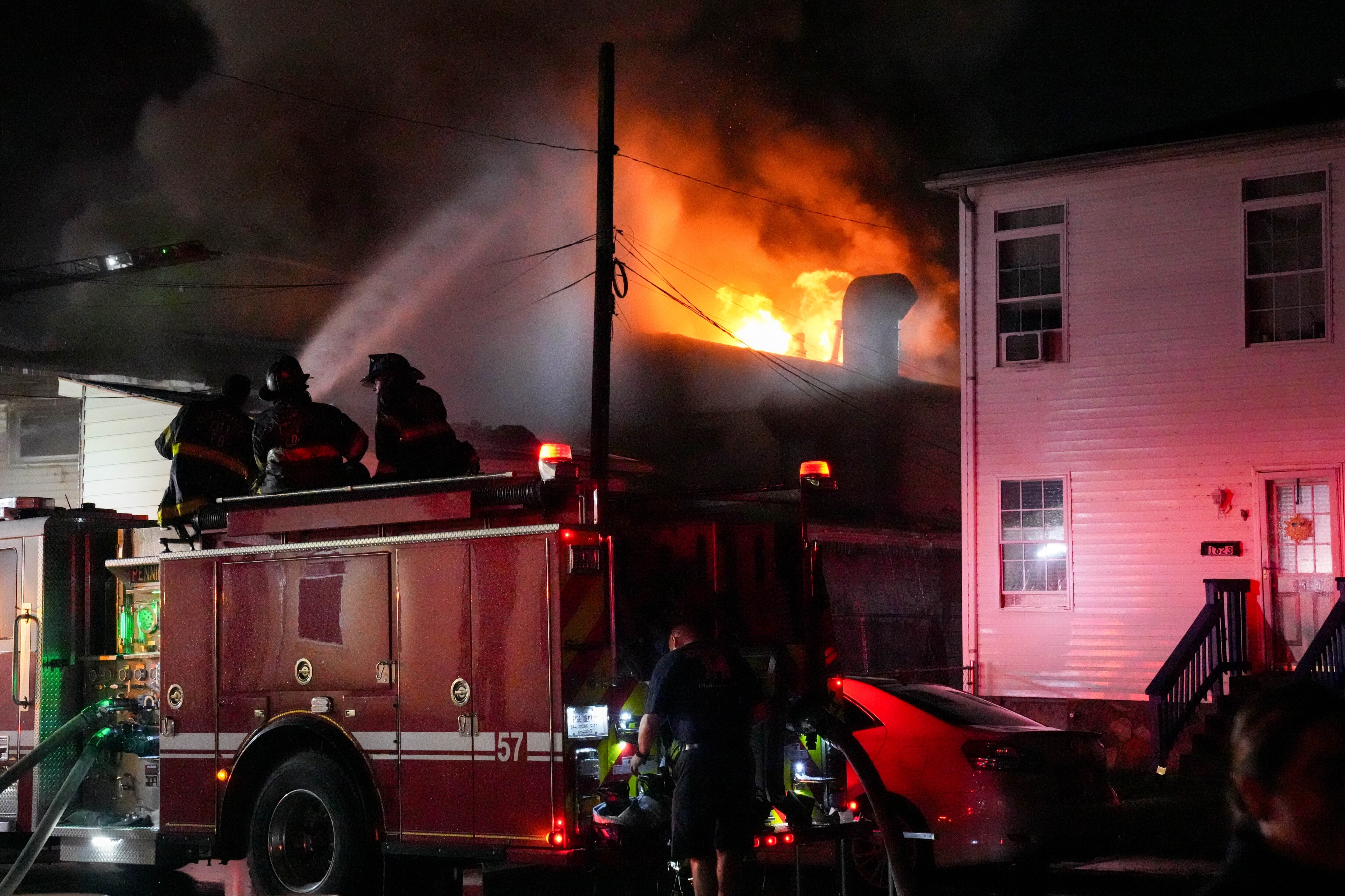 Baltimore firefighters battle a four-alarm fire in South Baltimore on Saturday.
