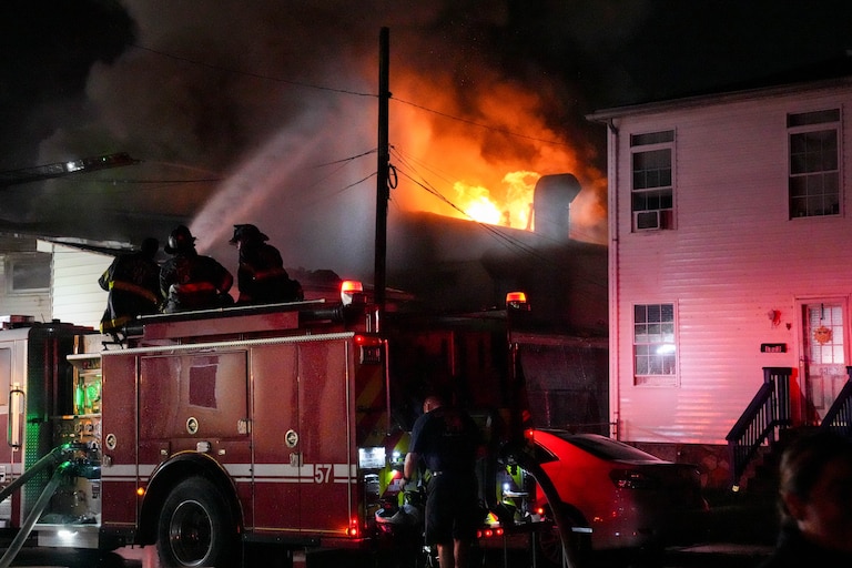 Baltimore firefighters battle a four-alarm fire in South Baltimore on Saturday.
