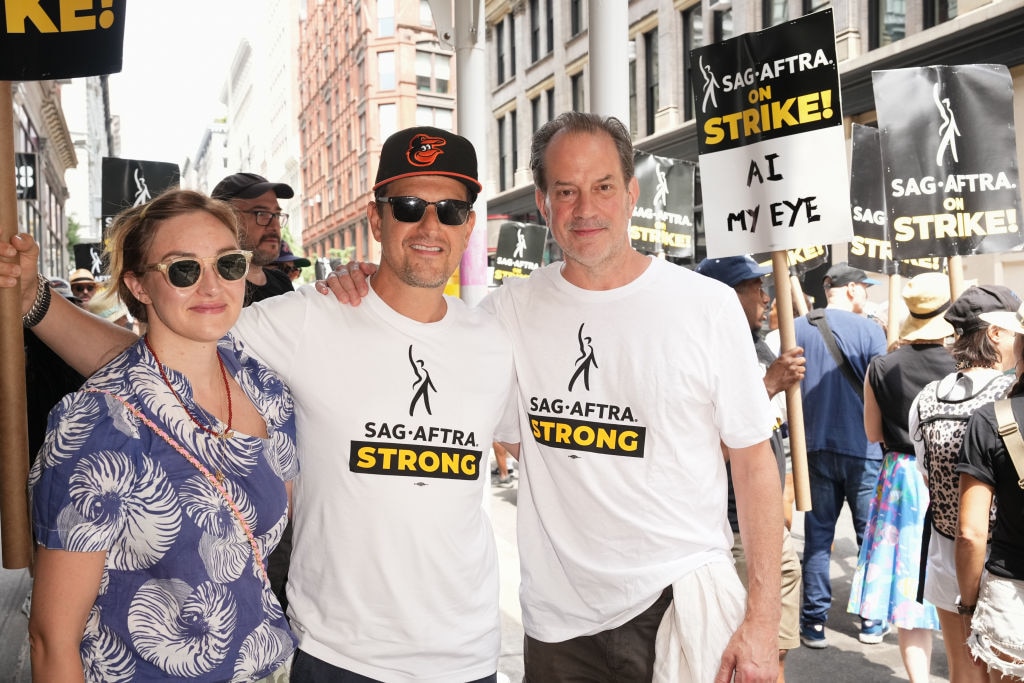 Josh Charles (C) joins SAG-AFTRA members on the picket line outside of Netflix and Warner Bros on July 20, 2023 in New York City. Members of SAG-AFTRA — Hollywood’s largest union, which represents actors and other media professionals — have joined striking WGA (Writers Guild of America) workers in the first joint walkout against the studios since 1960. The strike could shut down Hollywood productions completely with writers in the third month of their strike against the Hollywood studios.