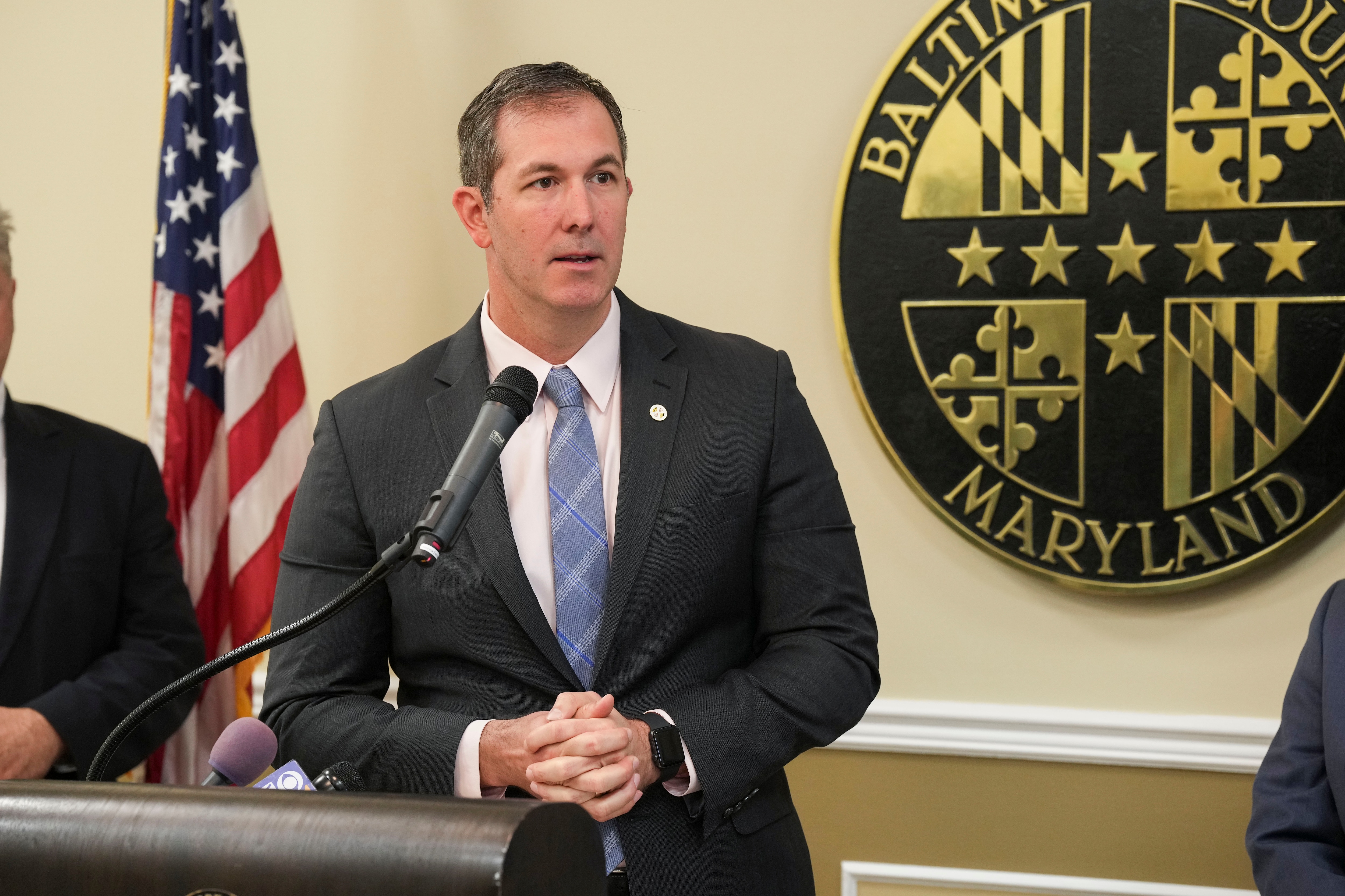 Johnny Olszewski, Baltimore County Executive, speaks at a press conference announcing a package of foundational legislative reforms to expand access to new housing opportunities as well as address community concerns in Baltimore County.