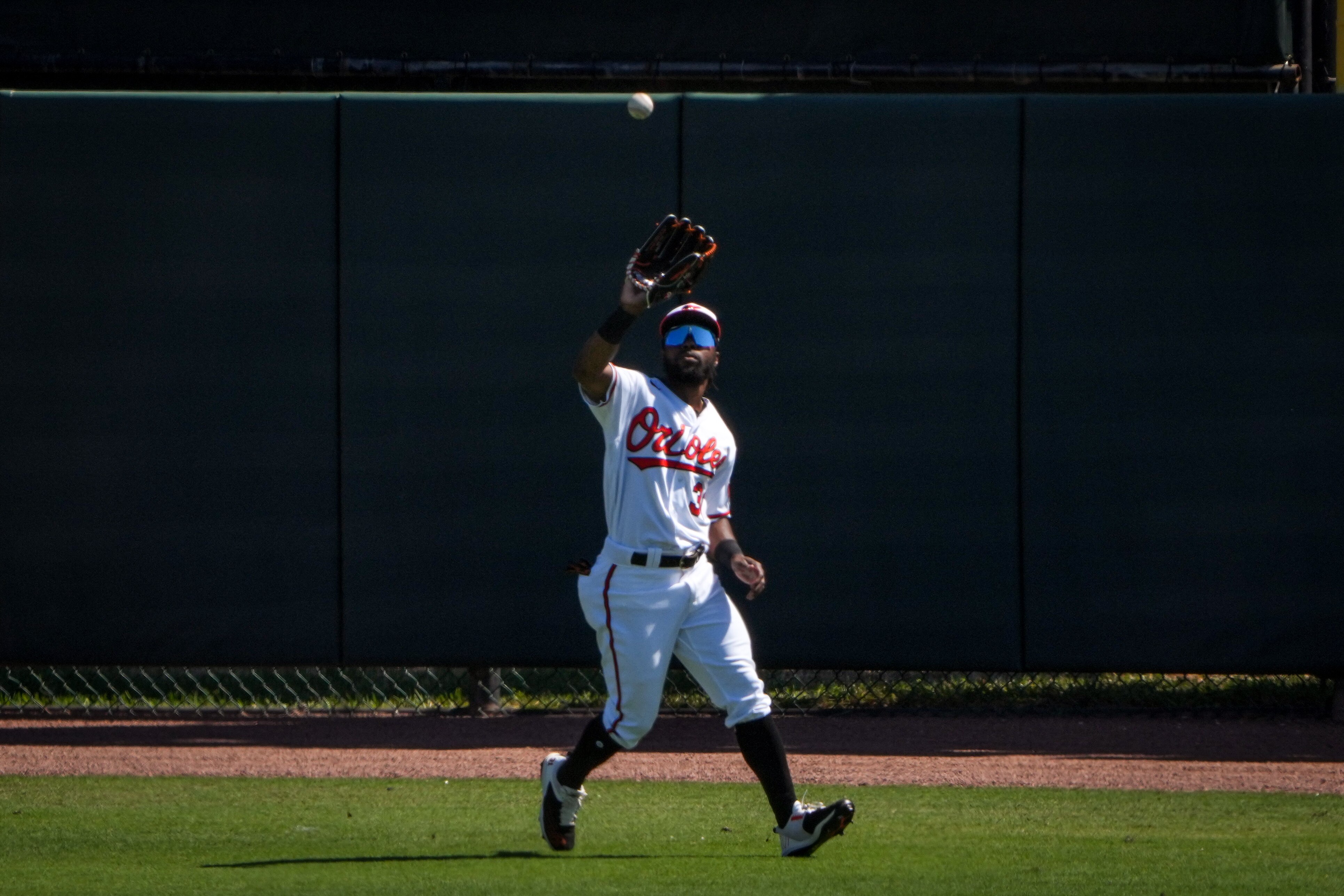 Cedric Mullins (31) catches a fly ball at Ed Smith Stadium during the third inning of a game against the Toronto Blue Jays on 3/1/23.