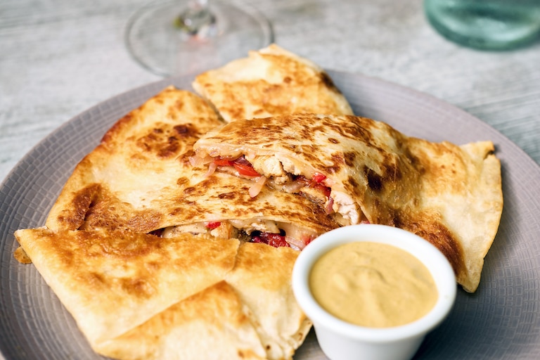Johnny's has a quesadilla with pulled chicken, Pepperjack cheese, roasted red peppers, and shaved onion on their Thursday "girl dinner" menu.