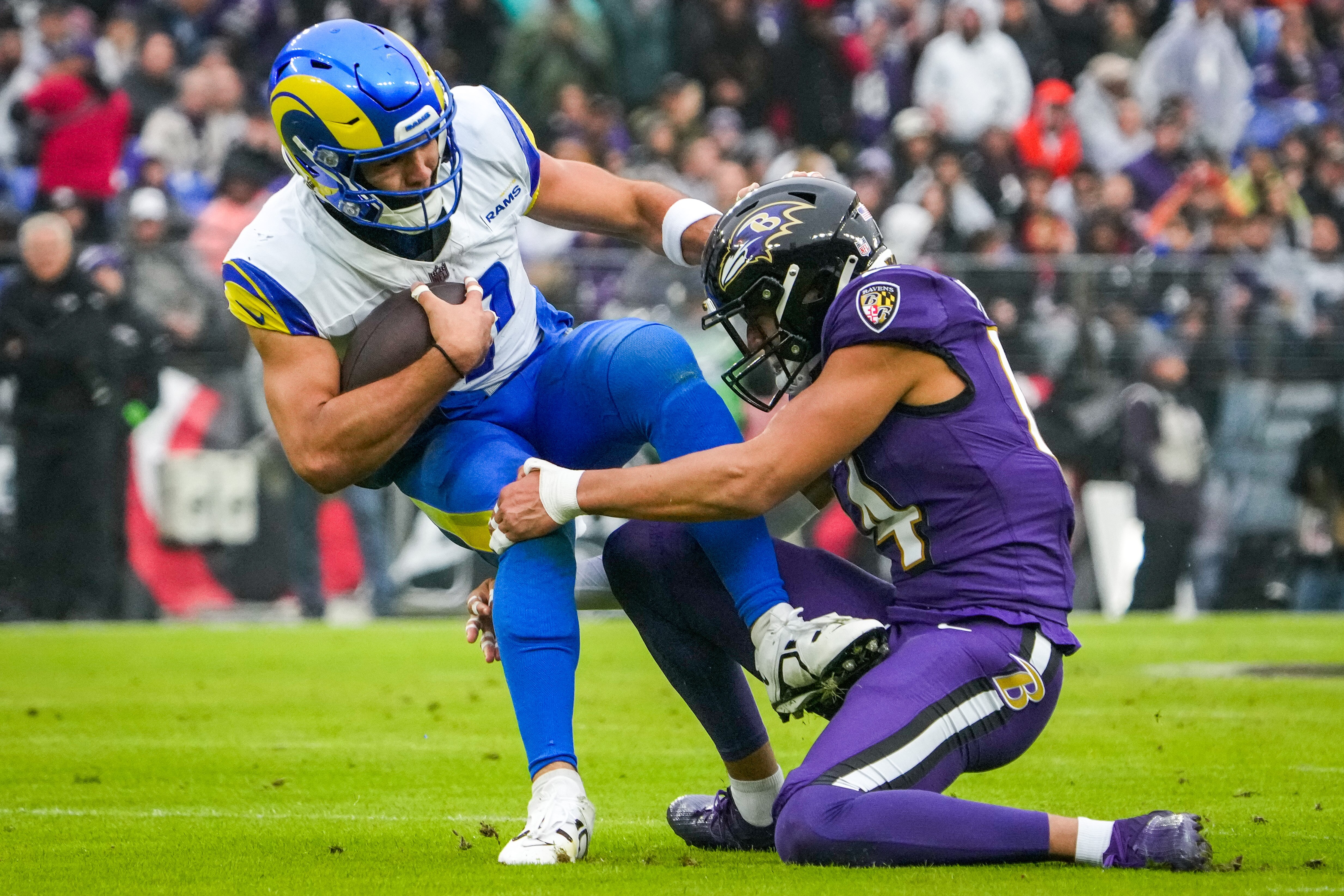 Ravens safety Kyle Hamilton tackles Los Angeles Rams wide receiver Puka Nacua during last week's game.